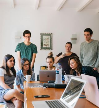 Group of People Watching on Laptop